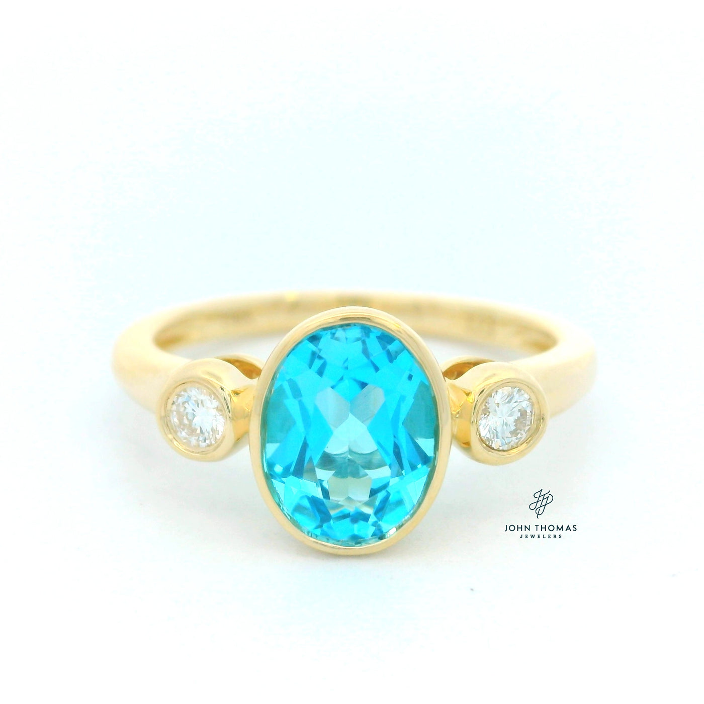BLUE TOPAZ AND DIAMOND THREE STONE RING