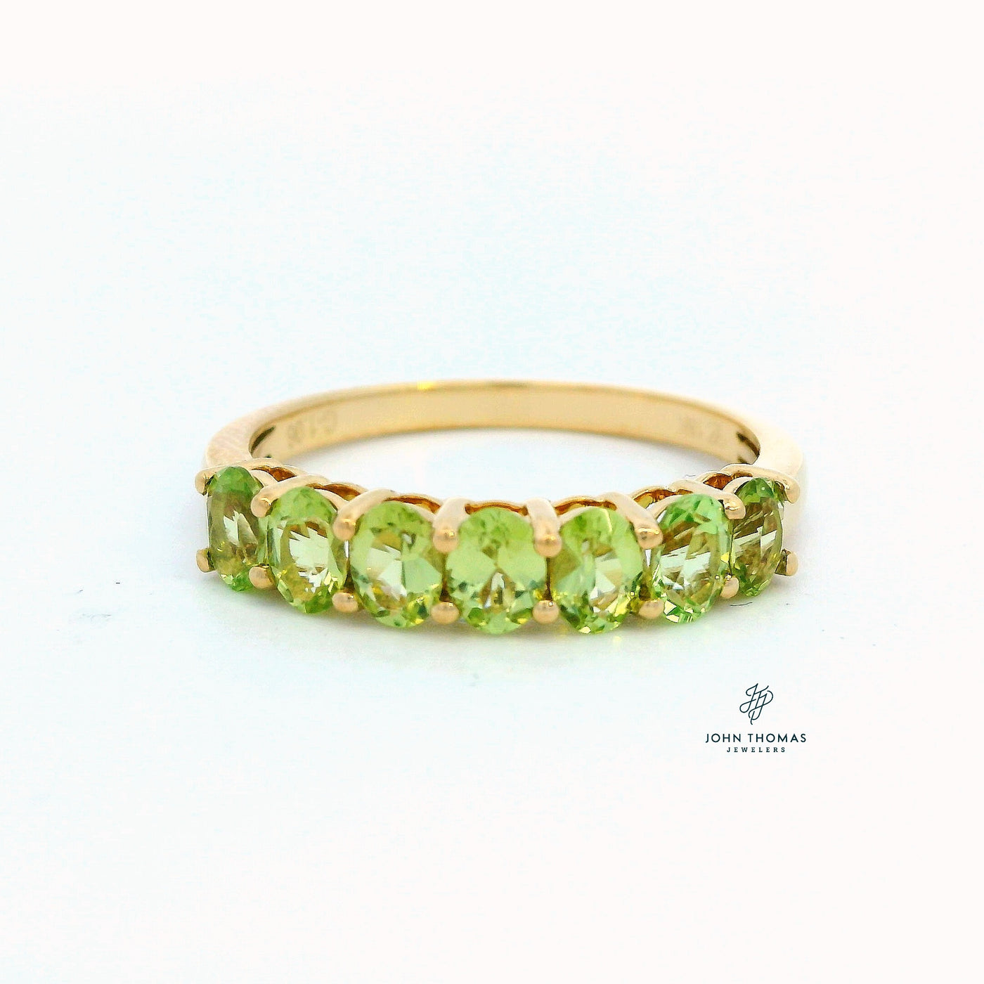 18K YELLOW GOLD SEVEN STONE PERIDOT RING