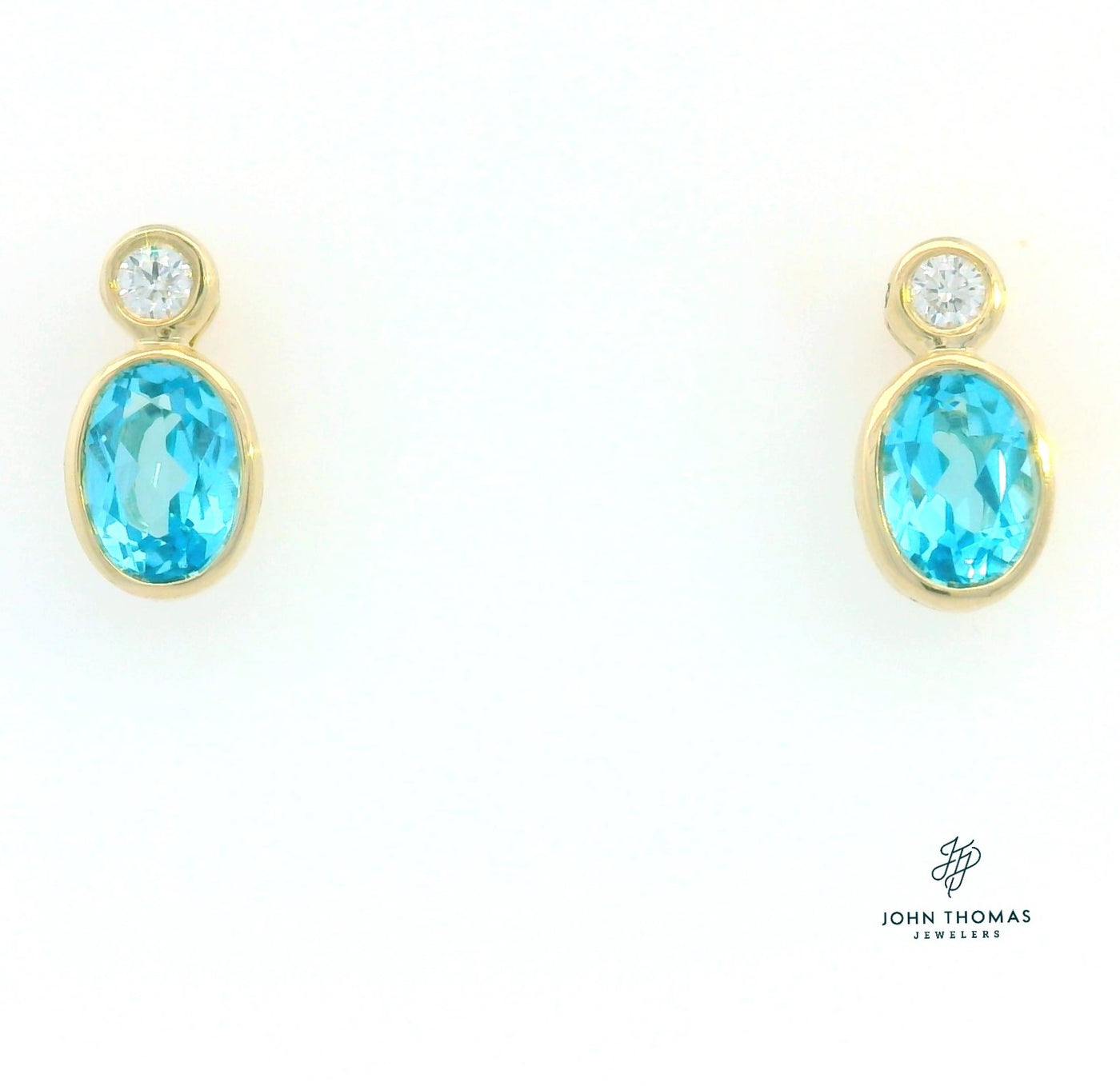 BLUE TOPAZ AND DIAMOND EARRINGS IN YELLOW GOLD