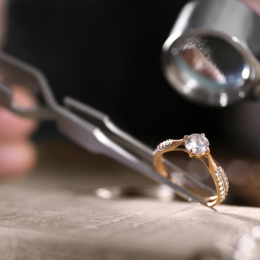 An appraiser performs a jewelry appraisal for a diamond engagement ring. 