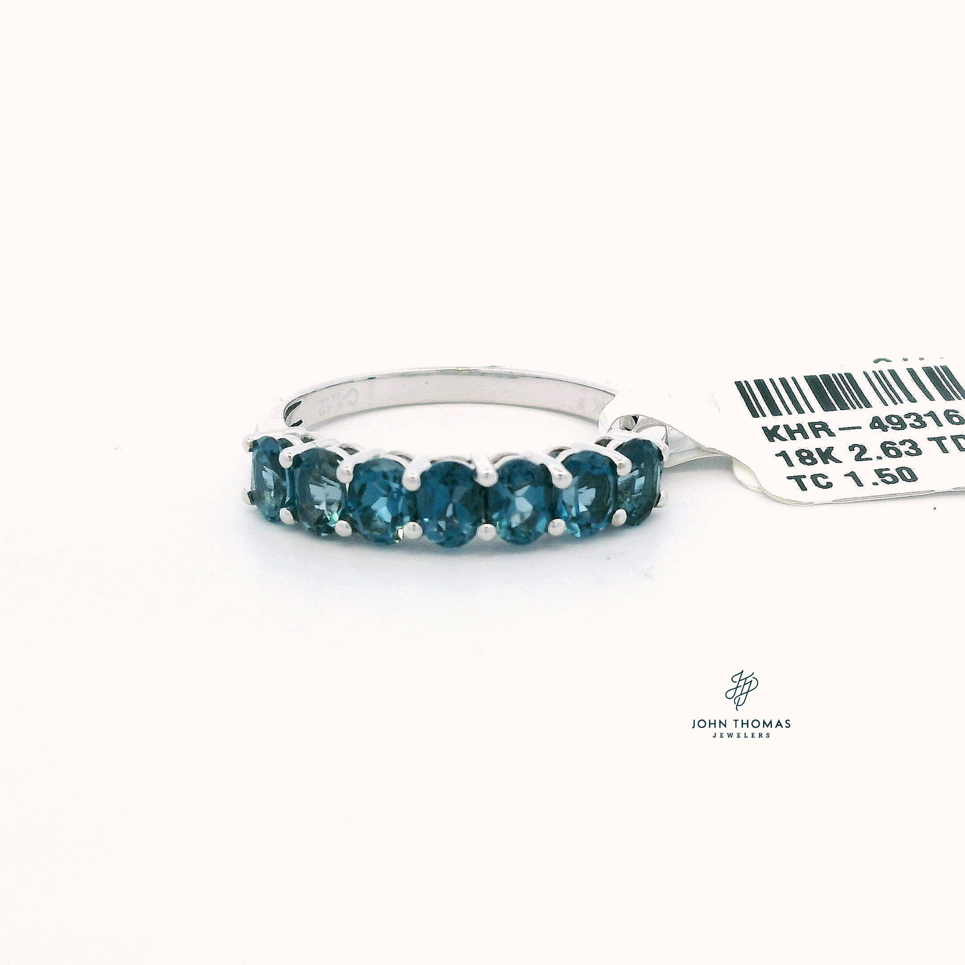 18KW SEVEN STONE LONDON BLUE TOPAZ RING