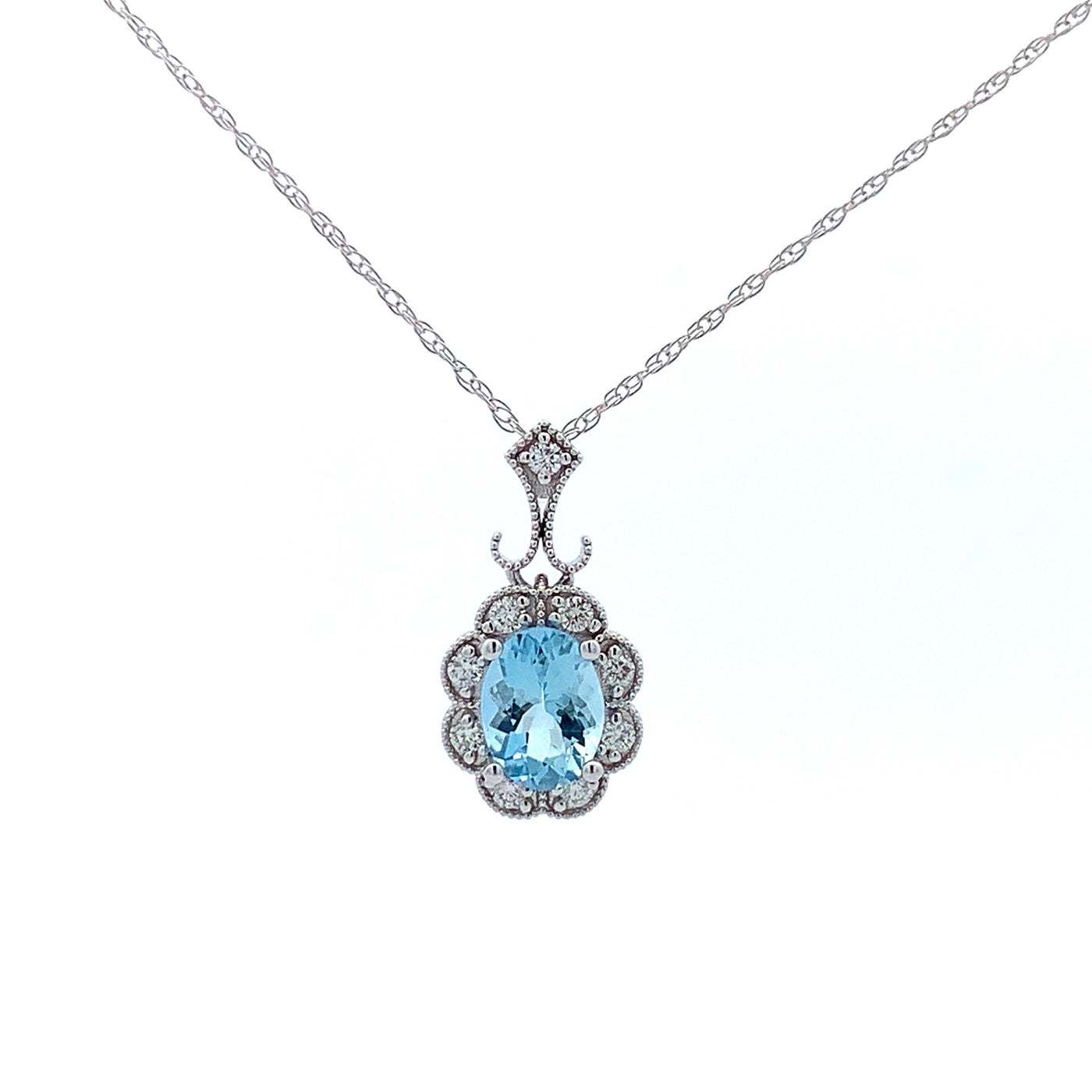 24KW AQUA COLOR STONE AND DIAMOND PENDANT