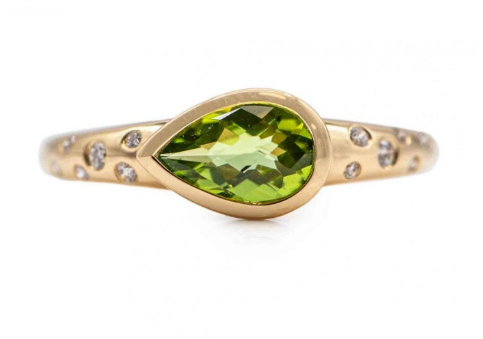 14KY EAST-WEST PERIDOT AND BURNISHED DIAMOND RING