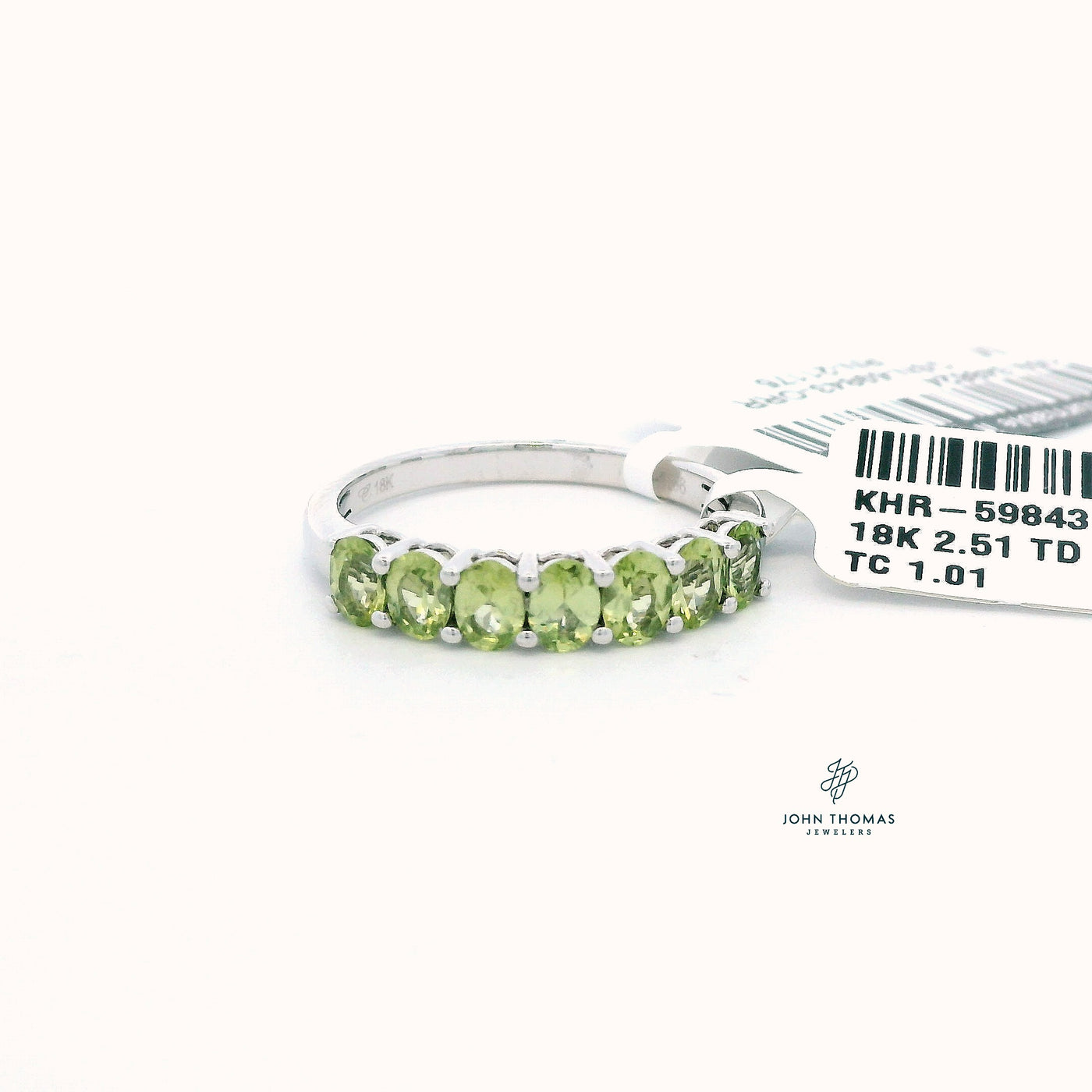 18KW SEVEN STONE PERIDOT RING